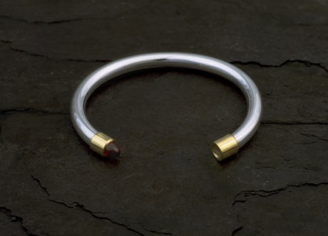 Silver Bangle with Gold Finials & Bullet Garnet by Steven Bourke, 2002
